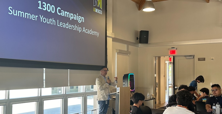 UC Merced Chancellor Juan Sánchez Muñoz is shown speaking to academy attendees.